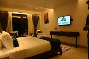 TV a/nebo společenská místnost v ubytování Vee Resort- The Suites of Royals
