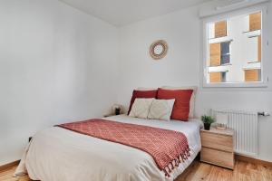 Posteľ alebo postele v izbe v ubytovaní Appartement Le Spacieux Lyonnais