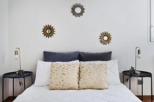 Posteľ alebo postele v izbe v ubytovaní Appartement Le Spacieux Lyonnais