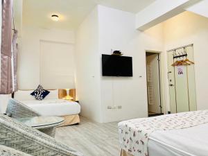 Televisyen dan/atau pusat hiburan di Sweet B&B 幸福微甜民宿