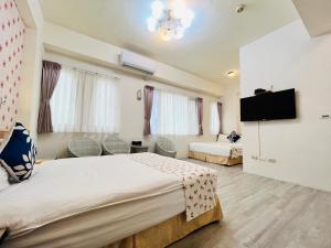 Televizors / izklaižu centrs naktsmītnē Sweet B&B 幸福微甜民宿