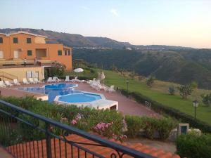 a view of a house with two swimming pools at Marasusa in Parghelia