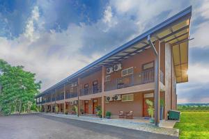 a building with balconies on the side of it at Birds Resort Hambantota in Hambantota