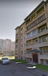 a car is parked in front of a building at Apartments near the center and airport in Tallinn