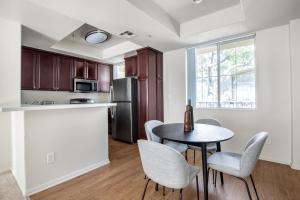 a kitchen and dining room with a table and chairs at Century City 2BR w WD BBQ nr Mall LAX-334 in Los Angeles