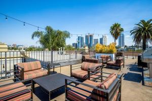 a patio with chairs and tables and a city skyline at Century City 2BR w WD BBQ nr Mall LAX-334 in Los Angeles