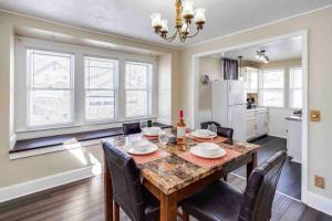 a kitchen and dining room with a table and chairs at Fabulous House near Airpt/DwTN/UofR in Rochester