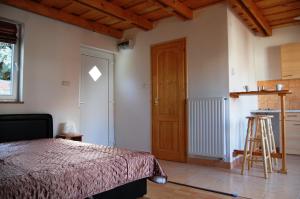 Postel nebo postele na pokoji v ubytování Maya Guesthouse