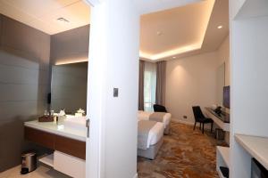 Postel nebo postele na pokoji v ubytování eStay Hotel
