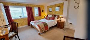 a small bedroom with a bed and a window at Salmon Landings in Strathy Point +40 photos