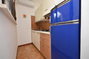 A kitchen or kitchenette at Appartamenti Alemagna