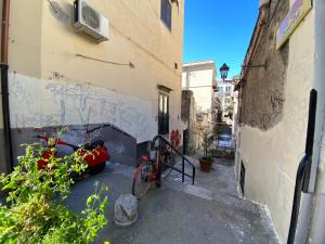 a bike parked next to a building with graffiti at Casa Vacanze Nina in Palermo