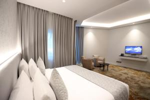 Postel nebo postele na pokoji v ubytování eStay Hotel