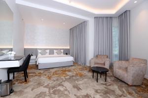 Postel nebo postele na pokoji v ubytování eStay Hotel