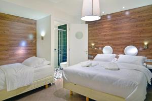 A bed or beds in a room at Z Inn Ioannina