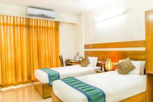 Ένα ή περισσότερα κρεβάτια σε δωμάτιο στο Dhaka Golden Inn - Banani'Lakeside +32 φωτογραφίες