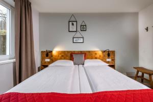 Postel nebo postele na pokoji v ubytování AlpenParks Residence Bad Hofgastein - gratis Thermeneintritt