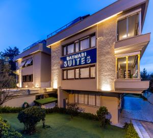 a building with a sign that reads baumann suites at BayMari Suites Plus Florya in Istanbul