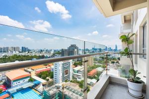 a balcony with a view of a city at Everrich Q5 - Two Bedroom in Ho Chi Minh City
