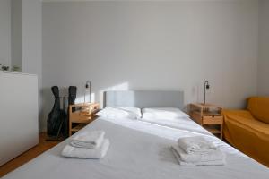 A bed or beds in a room at [Cozy apartment] Treviso 31