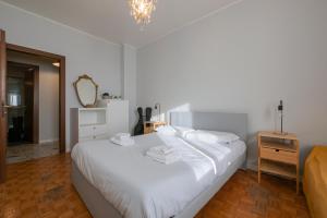 A bed or beds in a room at [Cozy apartment] Treviso 31