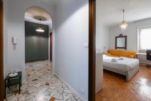 A bed or beds in a room at [Cozy apartment] Treviso 31