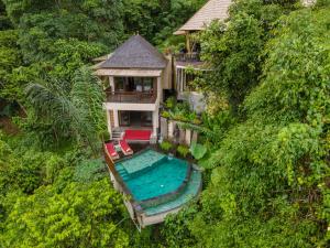 an aerial view of a house with a swimming pool at Jannata Resort and Spa in Ubud