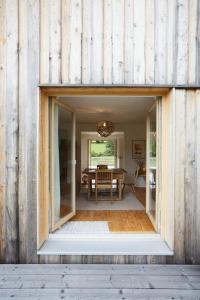 a barn conversion with a dining room and a table at Lichtzeit in Mauth