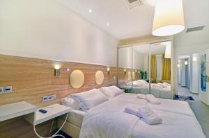 A bed or beds in a room at Z Inn Ioannina