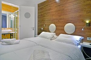 A bed or beds in a room at Z Inn Ioannina