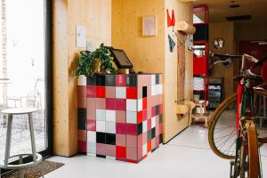 a room with a checkerboard wall at The Green Elephant Hostel & Spa in Maastricht