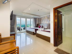Posteľ alebo postele v izbe v ubytovaní Dubai Nha Trang Hotel managed by HT