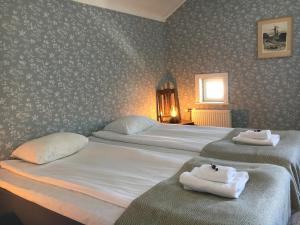 Postel nebo postele na pokoji v ubytování Brudhäll Hotel & Restaurant