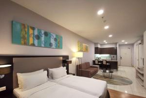 Voodi või voodid majutusasutuse Trinidad Suites Johor, Trademark Collection by Wyndham toas
