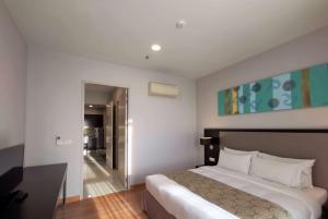 Voodi või voodid majutusasutuse Trinidad Suites Johor, Trademark Collection by Wyndham toas