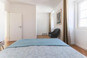 Postel nebo postele na pokoji v ubytování Sintra Flower Lux Apartments III