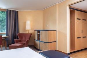 Postel nebo postele na pokoji v ubytování Vienna House by Wyndham Remarque Osnabrück