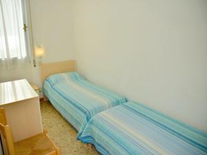 Tempat tidur dalam kamar di Seaview flat perfect for families-Beahost Rentals