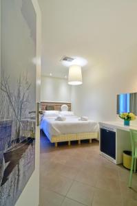 A bed or beds in a room at Z Inn Ioannina