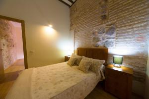 Postel nebo postele na pokoji v ubytování Apartamentos del Casco