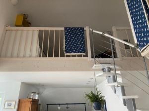 a stair case with an american flag on it at Das blaue Haus - ein Sommertraum und ein Wintermärchen in Weiler-Simmerberg