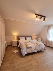 a bedroom with a large bed with two pillows at Apartment Seaside in Husum