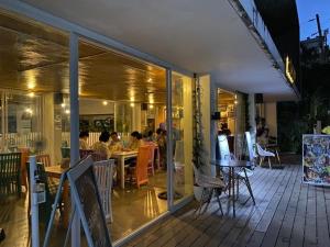 a restaurant with people sitting at tables on a patio at Seabird International Resort in Boracay