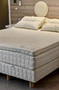 A bed or beds in a room at Z Inn Ioannina