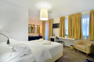 A bed or beds in a room at Z Inn Ioannina