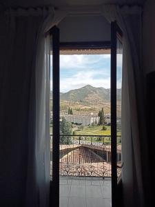 a window with a view of a mountain view at Portal De La Rioja in Haro