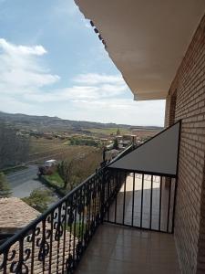 a balcony with a view of a river at Portal De La Rioja in Haro