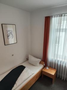 Ein Bett oder Betten in einem Zimmer der Unterkunft Gasthof Kronprinzen Ellwangen