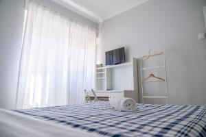 Säng eller sängar i ett rum på Maré Alta Alojamentos