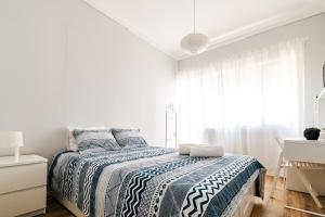 מיטה או מיטות בחדר ב-Maré Alta Alojamentos